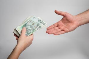 handing money to someone else hands
