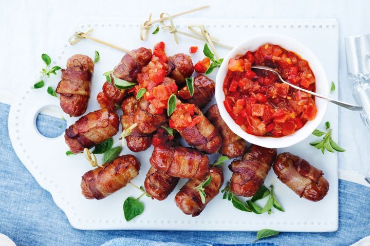 Bacon-wrapped beef sausages with tomato salsa